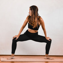Load image into Gallery viewer, Woman practicing yoga on Lauryan cork yoga mat — eco-friendly adult cork mat