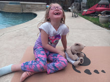 Load image into Gallery viewer, Young girl laughing on Lauryan kids cork yoga mat — safe eco-friendly children’s mat