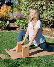 Load image into Gallery viewer, Woman using Lauryan cork yoga blocks outdoors on cork yoga mat — eco-friendly natural cork blocks