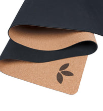 Load image into Gallery viewer, Adult practicing yoga on Lauryan cork yoga mat — premium sustainable cork surface