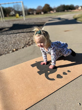 Load image into Gallery viewer, Child practicing yoga on Lauryan kids cork yoga mat — eco-friendly natural cork surface